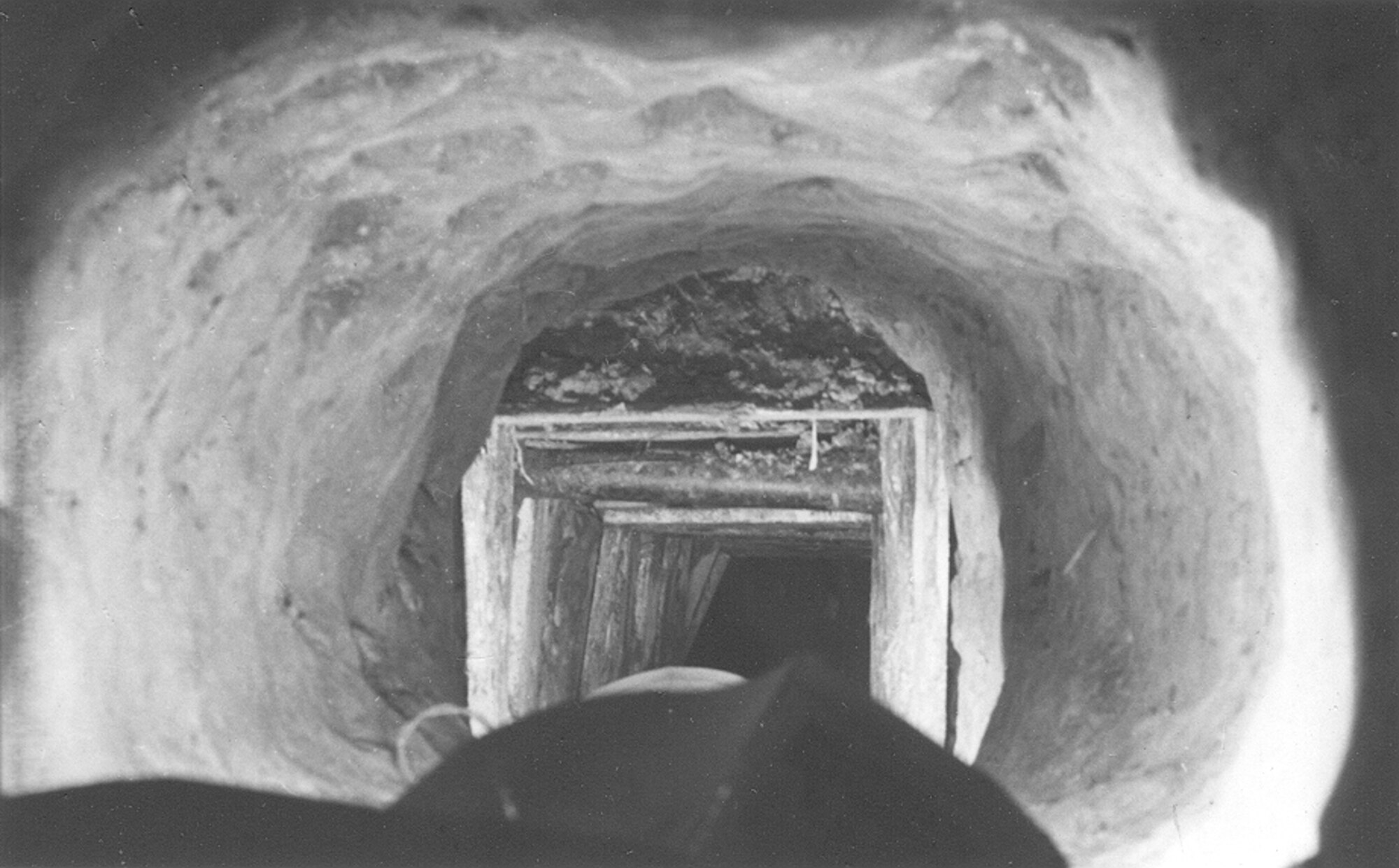 The tunnel pictured here allowed 76 Allied prisoners of war to escape Stalag Luft III in 1944. Lt. Gen. A. P. Clark played a critical role in this escape by managing the production of clothing, false travel papers, compasses, maps and other tools while in the POW camp to give his fellow prisoners the best possible chance of escape. (courtesy photo/Air Force Academy Special Collections)