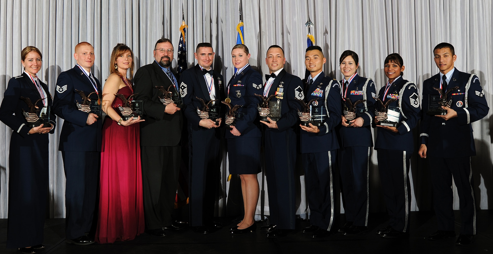 The winners of the 2009 Air Force Academy Awards are (left to right): Capt. Michelle Ruehl (company grade officer), Staff Sgt. Michael Clinkscales (NCO), Pamela Batzel (civilian category I), Erich Hoffmann (civilian category II), Senior Master Sgt. Roderick Schwald (first sergeant), Senior Airman Jessica Morehouse (Airman), Master Sgt. Robert Pemberton (senior NCO), Maj. Robert Bonner (Honor Guard officer), Staff Sgt. Michiyo Litynski (Honor Guard NCO), Master Sgt. Lissy Slezak (Honor Guard senior NCO) and Senior Airman Nhan Le (Honor Guard Airman). Not pictured is Keith Butala, the civilian category III winner. (U.S. Air Force photo/Rachel Boettcher)