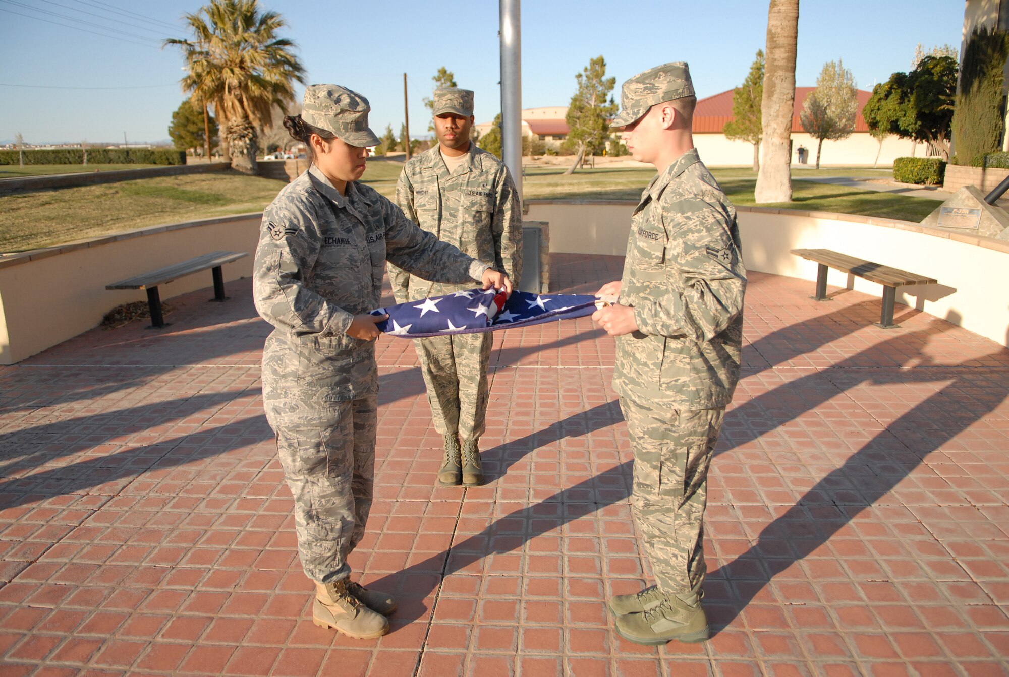 Airmen from the 95th Medical Group, fold the flag during a retreat ceremony at the Air Force Flight Test Center Headquarters March 11. This month, the 95th MDG hosted the retreat ceremony. (U.S. Air Force photo/Senior Airman William A. O'Brien) 