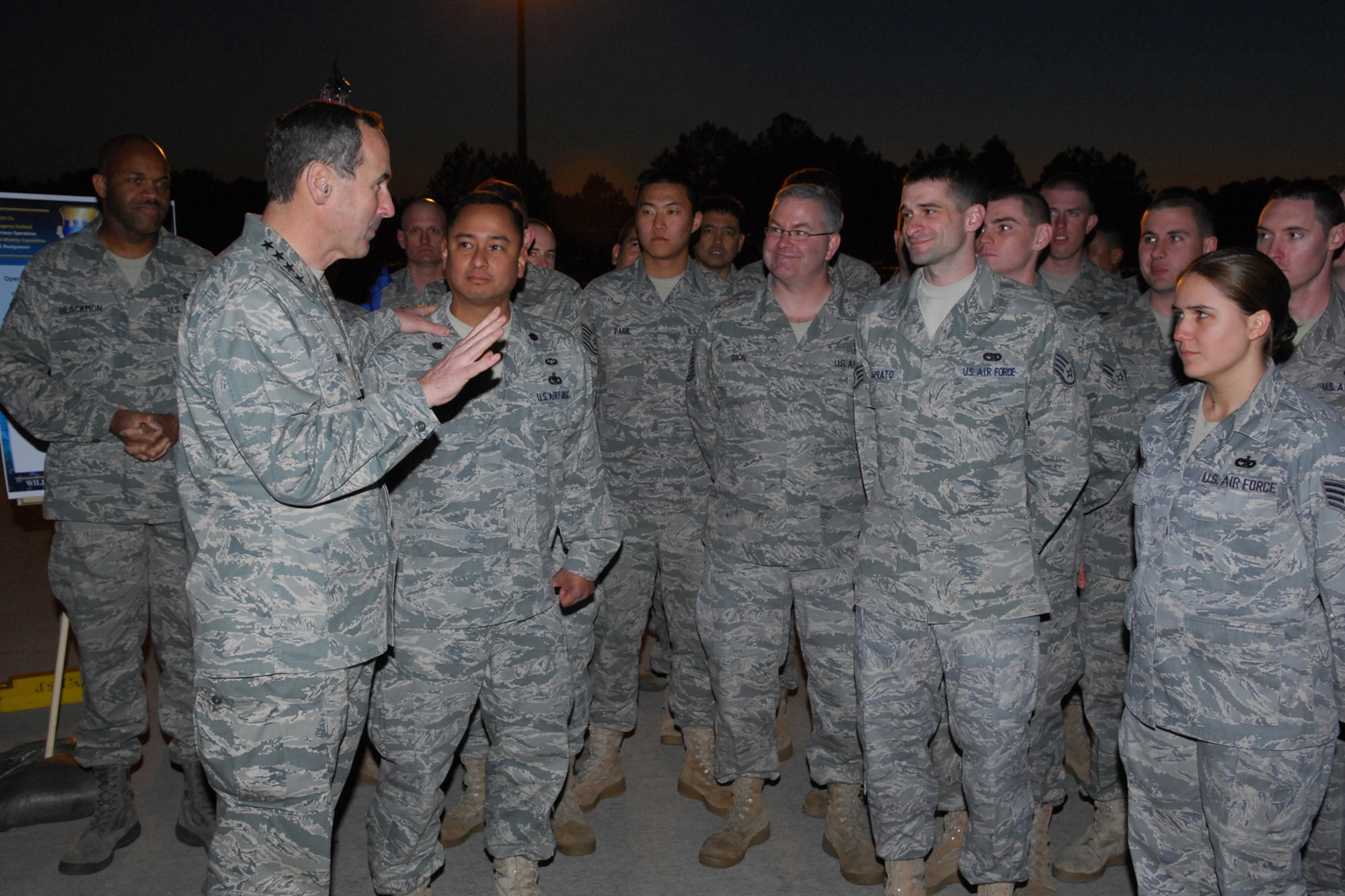 Gen. Raymond E. Johns Jr., commander of Air Mobility Command, visits with
Airmen at Pope Air Force Base, N.C., in February.  During the visit, Lt.
Gen. Frank Helmick, commander of the XVIII Airborne Corps at Fort Bragg,
N.C., presented an "Iron Mike" statuette to General Johns for the support
AMC provided in transporting the 82nd Airborne Division into Haiti. (Air Force
photo)