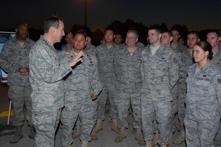 Gen. Raymond E. Johns Jr., commander of Air Mobility Command, visits with
Airmen at Pope Air Force Base, N.C., in February.  During the visit, Lt.
Gen. Frank Helmick, commander of the XVIII Airborne Corps at Fort Bragg,
N.C., presented an "Iron Mike" statuette to General Johns for the support
AMC provided in transporting the 82nd Airborne Division into Haiti. (Air Force
photo)