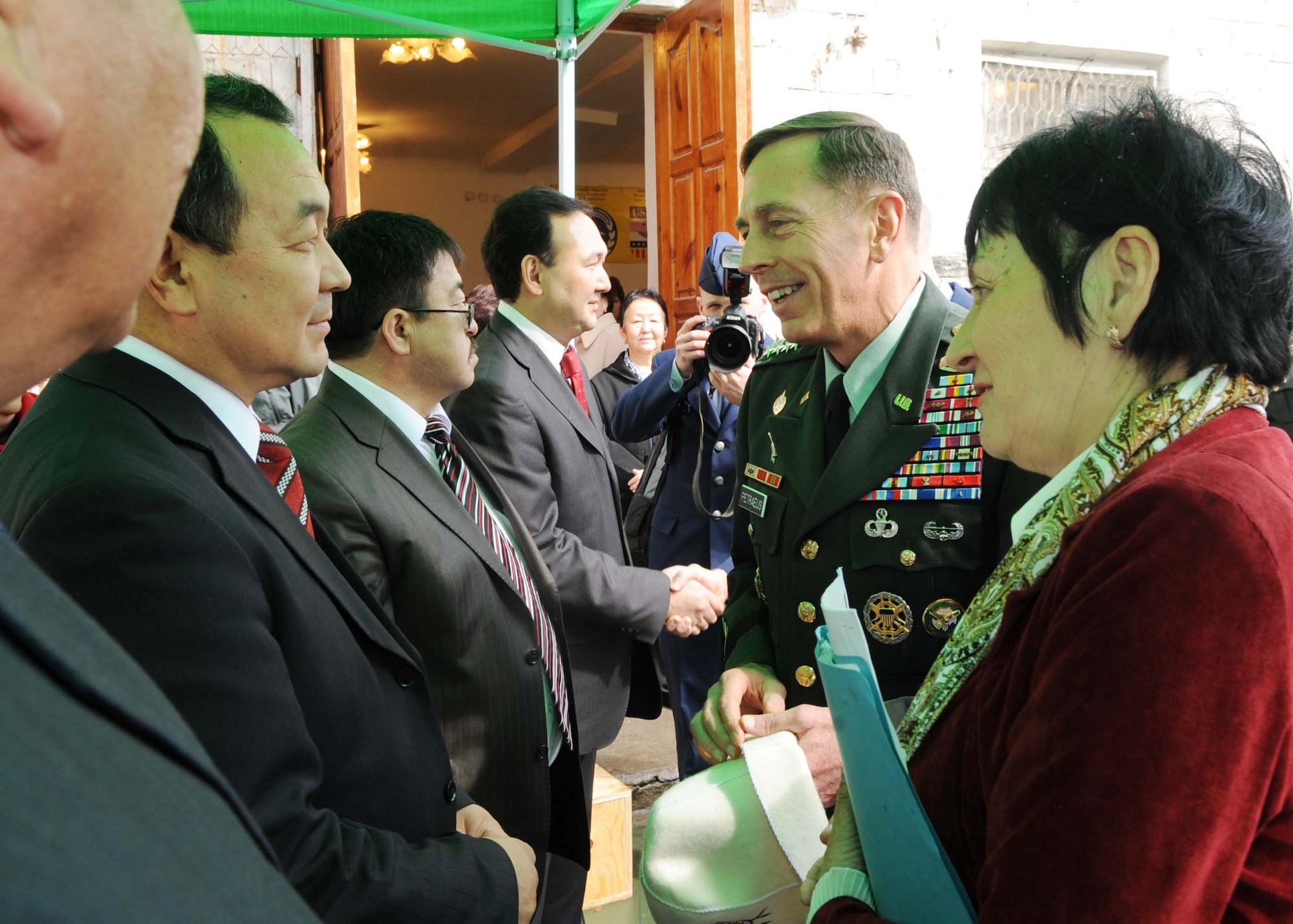 U.S. Army Gen. David Petraeus, Commander, U.S. Central Command, speaks with Kyrgyz government officials before the ground breaking ceremony for the Women's Center in Bishkek, Kyrgyzstan, March 11, 2010. (U.S. Air Force photo/Senior Airman Nichelle Anderson/released)

