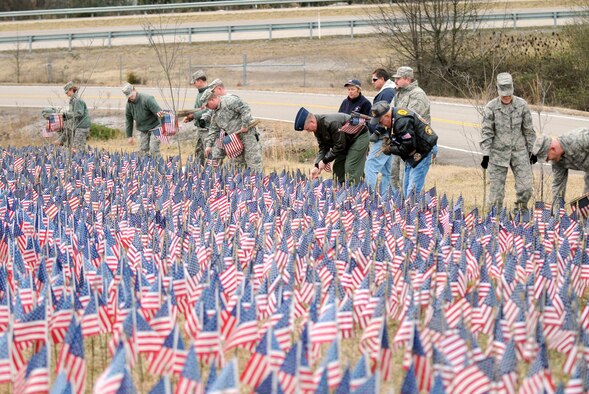McGHEE TYSON AIR NATIONAL GUARD BASE, Tenn. -- Service members from The I.G. Brown Air National Guard Training and Education Center help a West Knoxville church set up the Field of Flags, Feb. 12.  The Field of Flags exhibit honors the sacrifice of U.S. service members who have died in the wars in Iraq and Afghanistan. (U.S. Air Force photo by Master Sgt. Kurt Skoglund/Released)