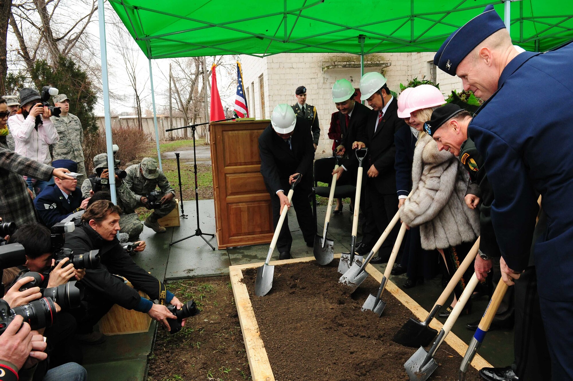 Army Gen. David Petraeus, Commander, U.S. Central Command, breaks ground with Transit Center at Manas director Air Force Col. Blaine Holt, U.S. Ambassador of Kyrgyzstan Tatiana Gfoeller, and other distinguished visitors during a ceremony at a building that will become the Women’s Center during the general’s trip to Kyrgyzstan, March 11, 2010. (U.S. Air Force photo/Staff Sgt. Carolyn Viss/released)