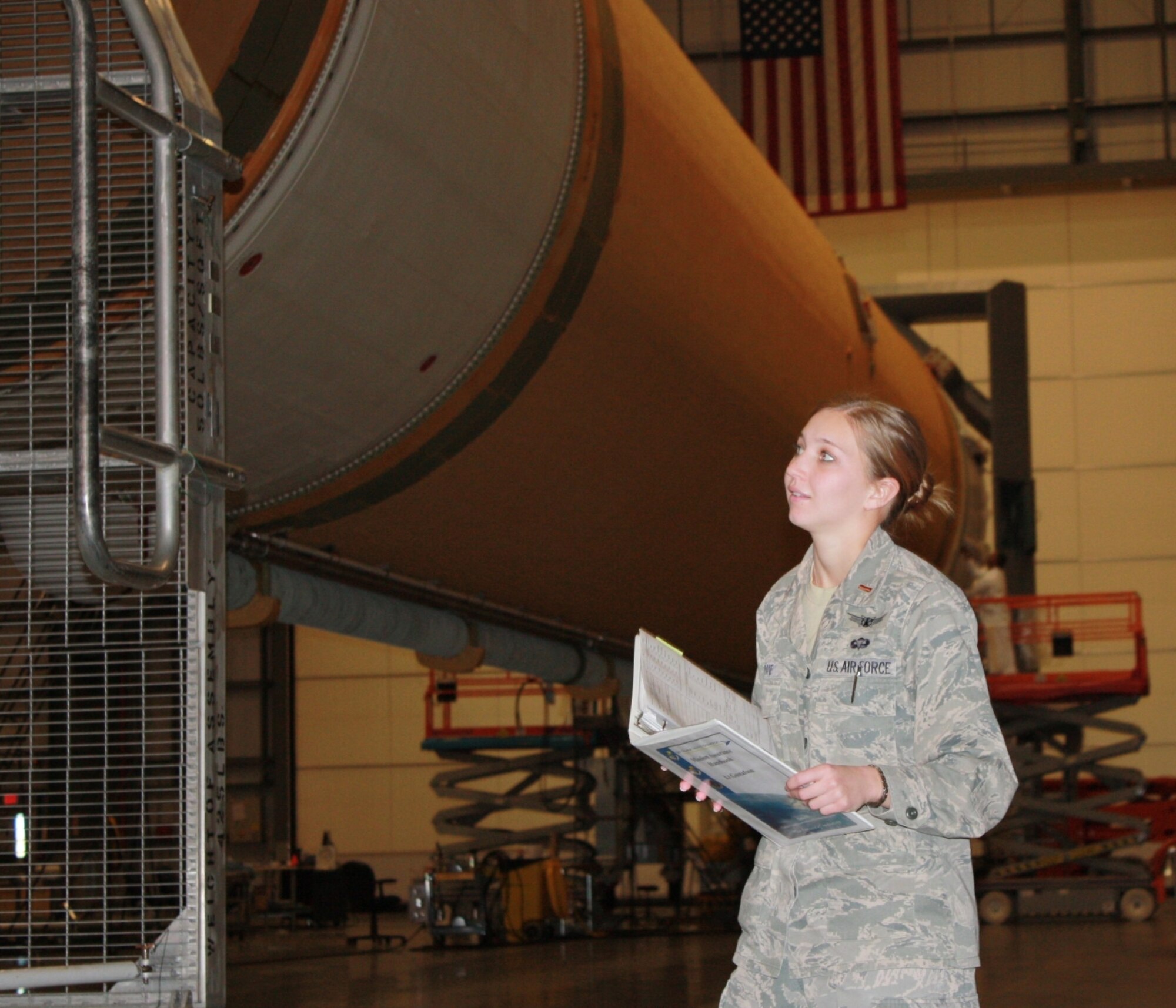 Delta IV Mechanical Engineer 2nd Lt. Elizabeth-Ann Bupane of the 5th Space Launch Squadron performs mission assurance observations of a Delta IV booster prior to it moving to the launch pad. The Delta IV lifted off March 4 carrying the NASA/NOAA Geostationary Operational Environmental Satellite P. (U.S. Air Force photo courtesy of Maj. Jeremy Geib)