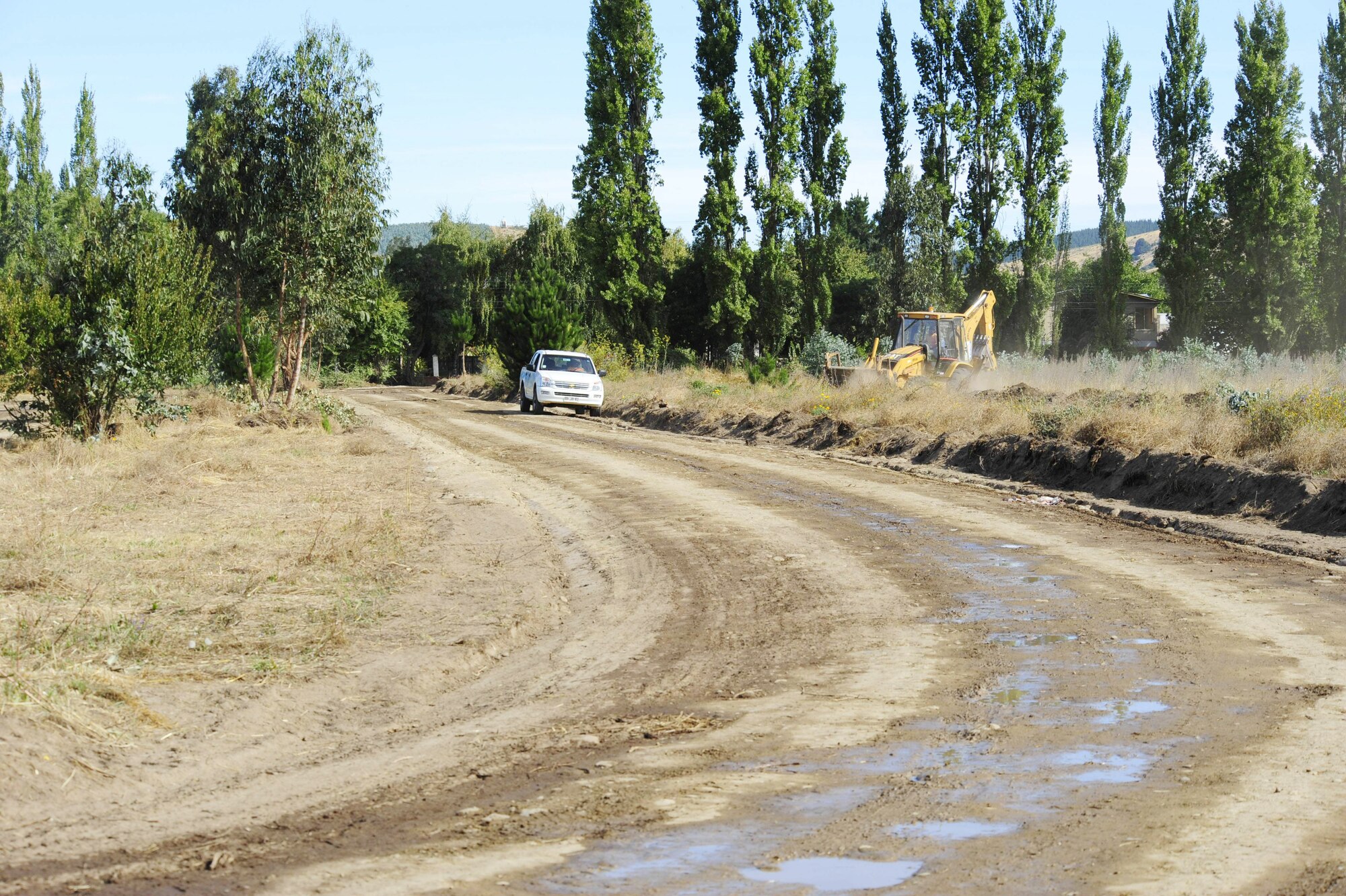 A road leads the way from the community of Angol, Chile, to the newly constructed Air Force Expeditionary Medical Support mobile hospital March 10, 2010. The local hospital in Angol, a city southeast of Conception, Chile, was destroyed as a result of an 8.8-magnitude earthquake Feb. 27. With the nearest operation ward 40 miles away, and many other local hospitals overwhelmed with casualties following the earthquake, local Chilean officials requested assistance from U.S. forces to help with primary care capabilities. (U.S. Air Force photo/Senior Airman Tiffany Trojca)