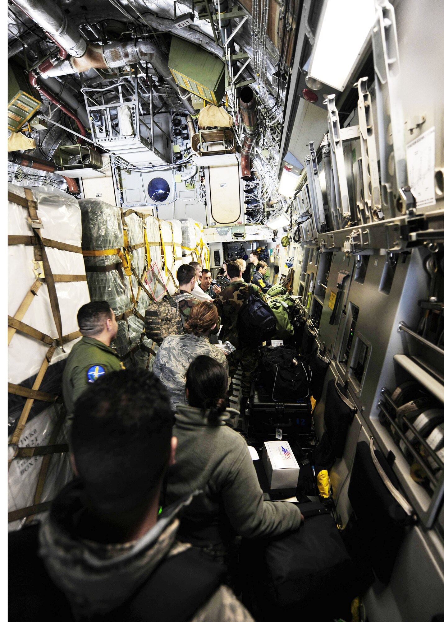 Airmen load onto a C-17 Globemaster III awaiting departure March 8, 2010, from Lackland Air Force Base, Texas. The Airmen are part of an Air Force Expeditionary Medical Support team that deployed to Angol, Chile, to augment medical care for more than 110,000 Chileans in the region. (U.S. Air Force photo/Senior Airman Tiffany Trojca)