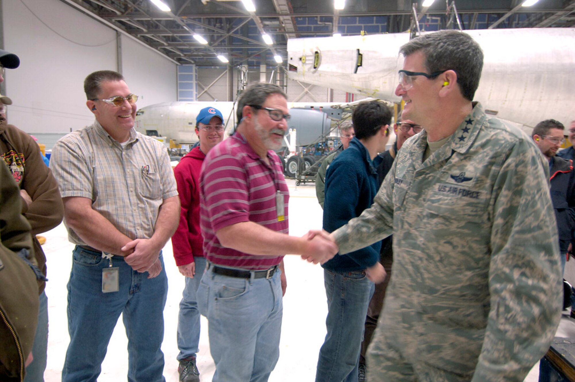 Lt. Gen. Rusty Findley, Air Mobility Command vice commander, thanks employees in the Oklahoma City Air Logistics Center’s inspection dock for their work supporting the warfighter. General Findley visited Tinker with other senior leaders from AMC and Air Force Materiel Command to attend a review of the center’s Programmed Depot Maintenance process and transformation efforts. (Air Force photo by Margo Wright)