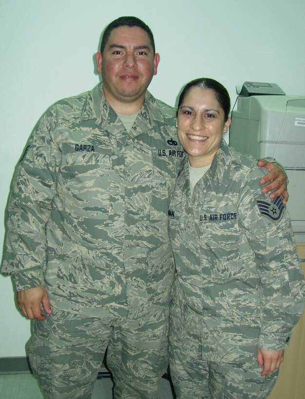 U.S. Air Force Tech. Sgt. Ramiro Orlando Garza, 506th Expeditionary Logistics Readiness Squadron vehicle operator, spends time with his little sister Staff Sgt. Christine Marie Roman, 386th Logistics Readiness Squadron logistics planner, Feb. 11, 2010 at an air base in Southwest Asia while transiting through the base to Iraq. Sergeant Roman is deployed from the Global Strike Command at Barksdale Air Force Base, La. and Sergeant Garza is deployed from the 433rd Logistics Readiness Squadron at Lackland AFB, Texas. Teh siblings are natives of San Antonio, Texas. (U.S. Air Force photo/Released)