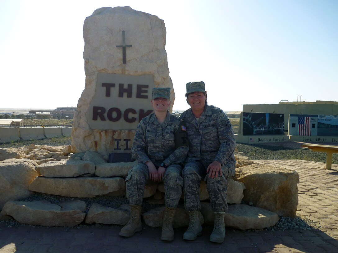 U.S. Air Force Airman 1st Class Audrey Gill and her mother Tech. Sgt. Terril Gill, both from the 134th Air Refueling Wing, Tennessee Air National Guard, enjoy their first deployment together March 5, 2010 at an air base in Southwest Asia. Airman Gill is assigned to the 386th Expeditionary Civil Engineer Squadron, while her mother is assigned to the 386th Expeditionary Maintenance Group. (U.S. Air Force photo by Staff Sgt. Lindsey Maurice/Released)