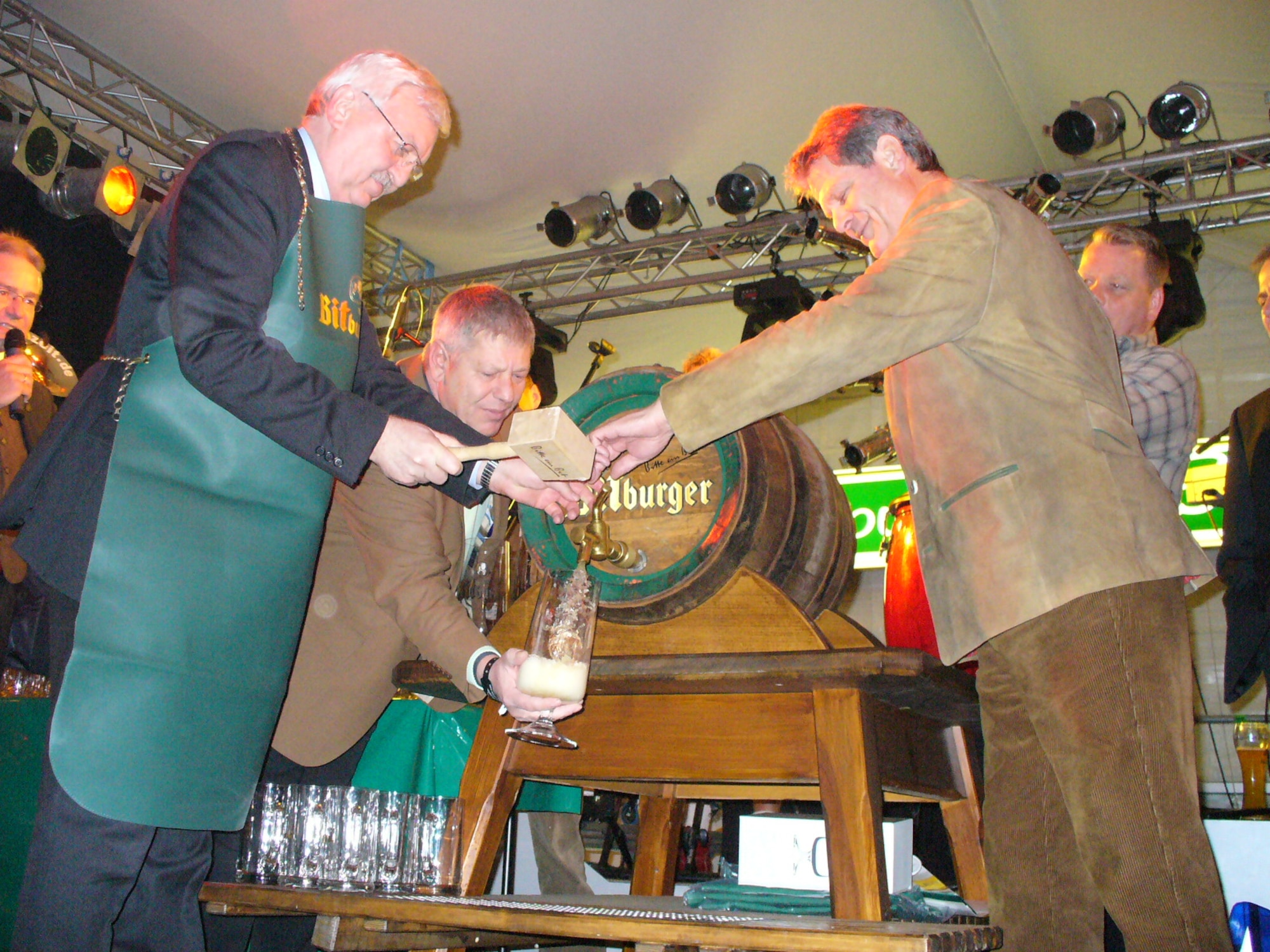 City and Bitburg Brewery officials, along with some invited guests, tap the first keg of beer during the opening ceremonies of the Bitburg Bier festival. (U.S. Air Force photo/Iris Reiff)