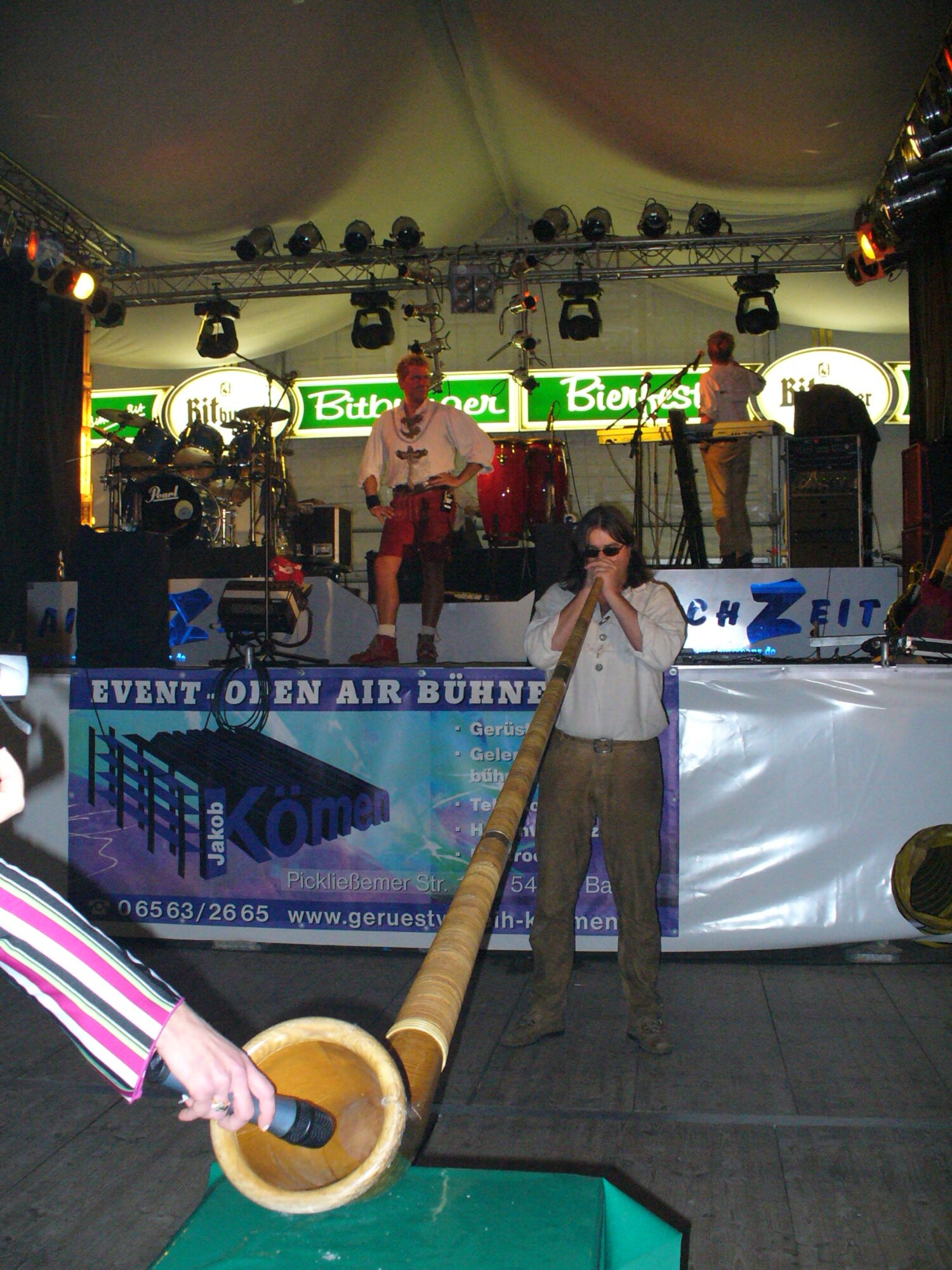 A member of the band “Aischzeit” plays an Alp horn to entertain guests during the official opening of the Bitburg Bier festival. (U.S. Air Force photo/Iris Reiff)