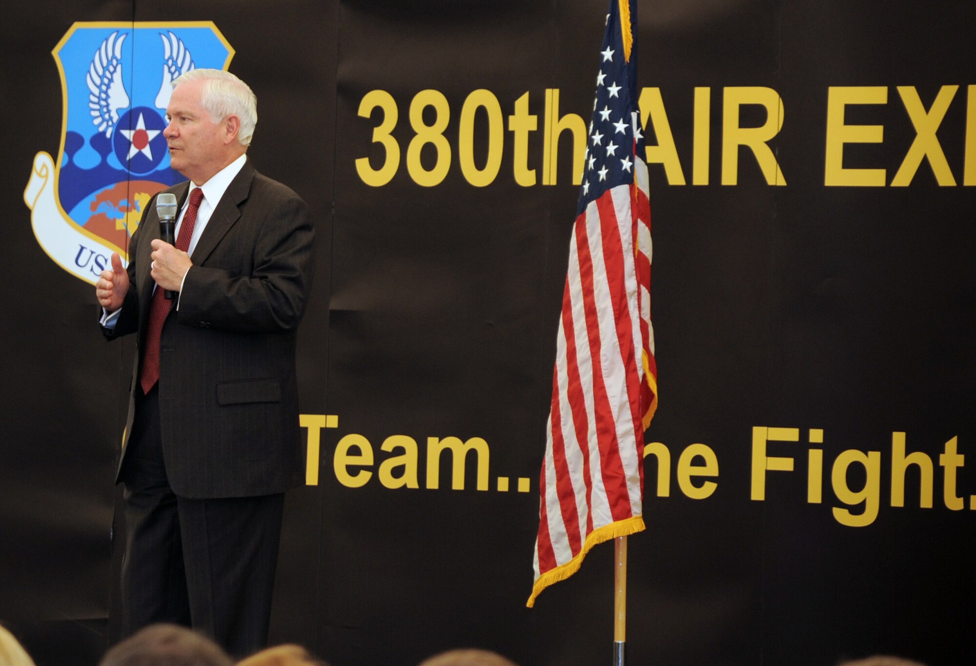 U.S. Defense Secretary Robert M. Gates addresses the men and women of the 380th Air Expeditionary Wing at an non-disclosed location in Southwest Asia on March 11, 2010. During the town hall meeting, Secretary Gates gave some brief comments, answered questions from the deployed service members, and presented each in attendance with a coin.  The stop at the 380th AEW was part of Secretary Gates' trip through several countries meeting with U.S. allies.  (U.S. Air Force Photo/Master Sgt. Scott T. Sturkol/Released)