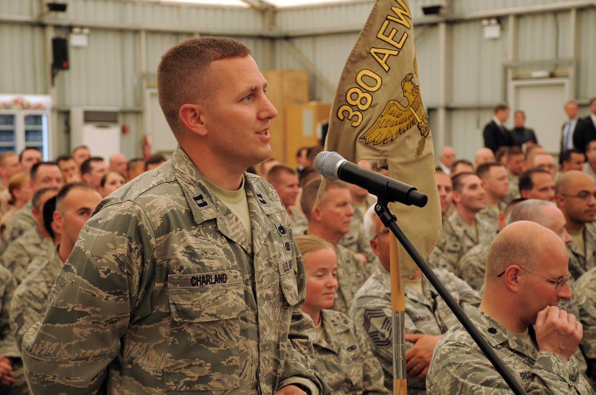 Capt. Gary Charland of the 380th Expeditionary Aircraft Maintenance Squadron asks a question to U.S. Defense Secretary Robert M. Gates during his visit to see the men and women of the 389th Air Expeditionary Wing at an non-disclosed location in Southwest Asia on March 11, 2010. (U.S. Air Force Photo/Master Sgt. Scott T. Sturkol/Released)