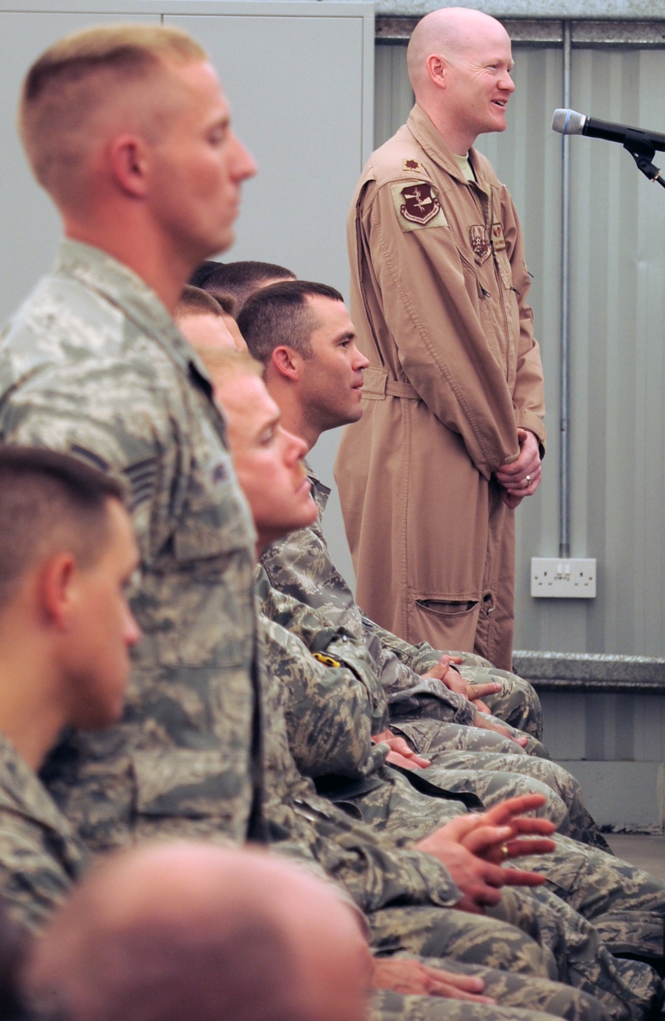 Maj. Kevin Bohnsack, from the 380th Expeditionary Medical Group, asks U.S. Defense Secretary Robert M. Gates a question during the secretary's visit to the men and women of the 380th Air Expeditionary Wing at an non-disclosed location in Southwest Asia on March 11, 2010. (U.S. Air Force Photo/Master Sgt. Scott T. Sturkol/Released)