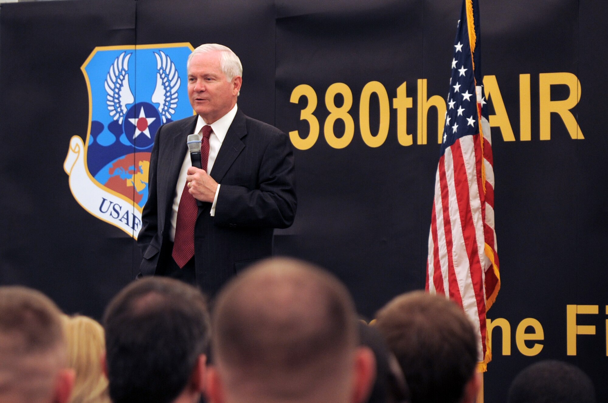 U.S. Defense Secretary Robert M. Gates addresses the men and women of the 380th Air Expeditionary Wing at an non-disclosed location in Southwest Asia on March 11, 2010. During the town hall meeting, Secretary Gates gave some brief comments, answered questions from the deployed service members, and presented each in attendance with a coin.  The stop at the 380th AEW was part of Secretary Gates' trip through several countries meeting with U.S. allies.  (U.S. Air Force Photo/Master Sgt. Scott T. Sturkol/Released)
