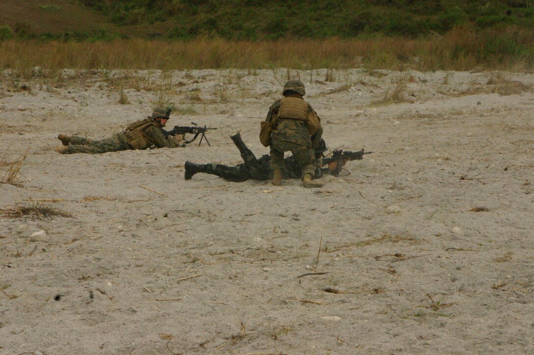 Republic of the Philippines Marines and U.S. Marines with Battalion Landing Team 2nd Battalion, 7th Marines (BLT 2/7), 31st Marine Expeditionary Unit (MEU), fire rounds down range during a small-arms shoot, March 13.   The small-arms shoot was part of bilateral training being conducted during exercise Balikatan 2010 (BK ’10). (Official Marine Corps photo by Cpl. Michael A. Bianco)