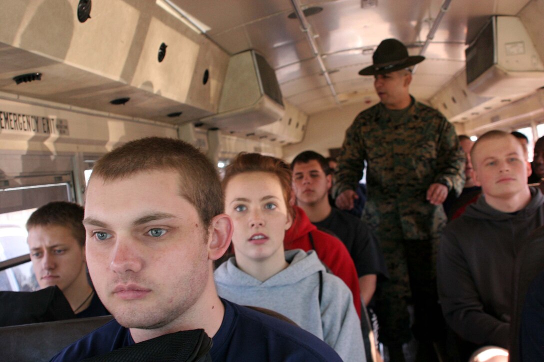 Gunnery Sgt. Abraham C. Bueno introduces himself to poolees on a bus during the 5th Annual Poolee Function here. Bueno, was one of three Marines assigned to Recruiting Station Fort Worth who served as drill instructors during the event. The purpose of the two-day evolution was to familiarize poolees with the rigors they will face when they ship to Marine Corps Recruit Depot San Diego or Parris Island for boot camp. (U.S. Marine Corps photo by Sgt. Ray Lewis)