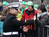 CHICAGO—Sgt. Roberto Corona, a recruiter from Recruiting Substation North Center, Recruiting Station Chicago, shakes hand with spectators of the 2010 Saint Patrick’s Day Parade March 13. Corona, along with Marines from the Chicagoland area participated in the parade and were welcomed with open arms by the patriotic people of Chicago. (U.S. Marine Corps photo by Sgt. George J. Papastrat) (Released)