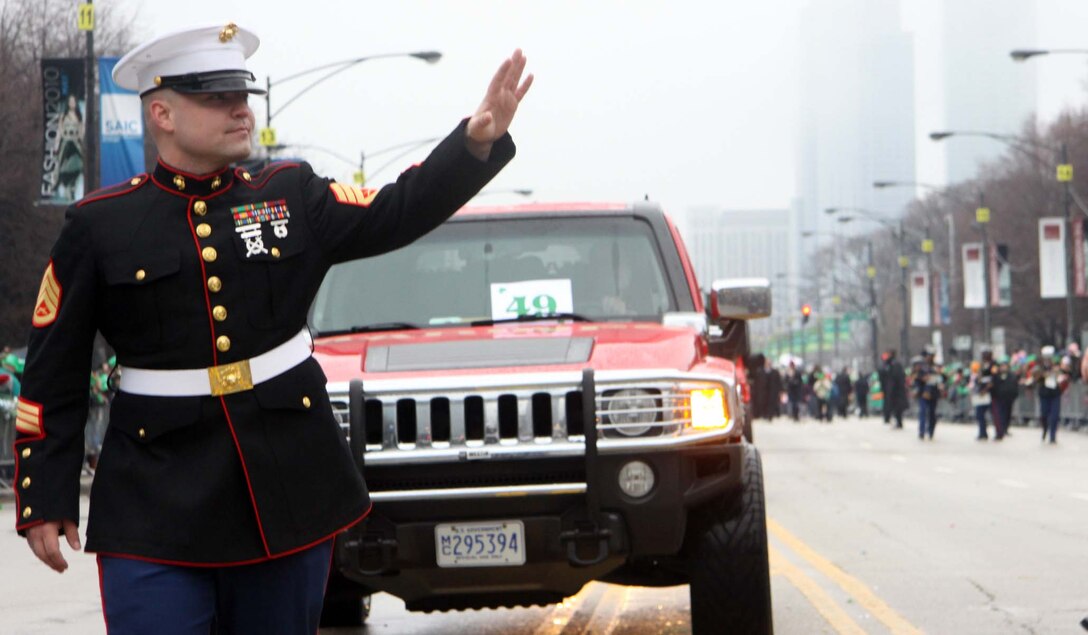 CHICAGO – Staff Sgt. Jesse Dollar, a recruiter from Marine Recruiting Station Chicago, Recruiting Substation North Center, waves to a welcoming crowd at the 2010 Chicago Saint Patrick’s Day Parade March 13. The RS Chicago Marines teamed up with 2nd Battalion 24th Marine Regiment to celebrate the Irish Heritage. (U.S. Marine Corps photo by Sgt. George J. Papastrat) (Released)