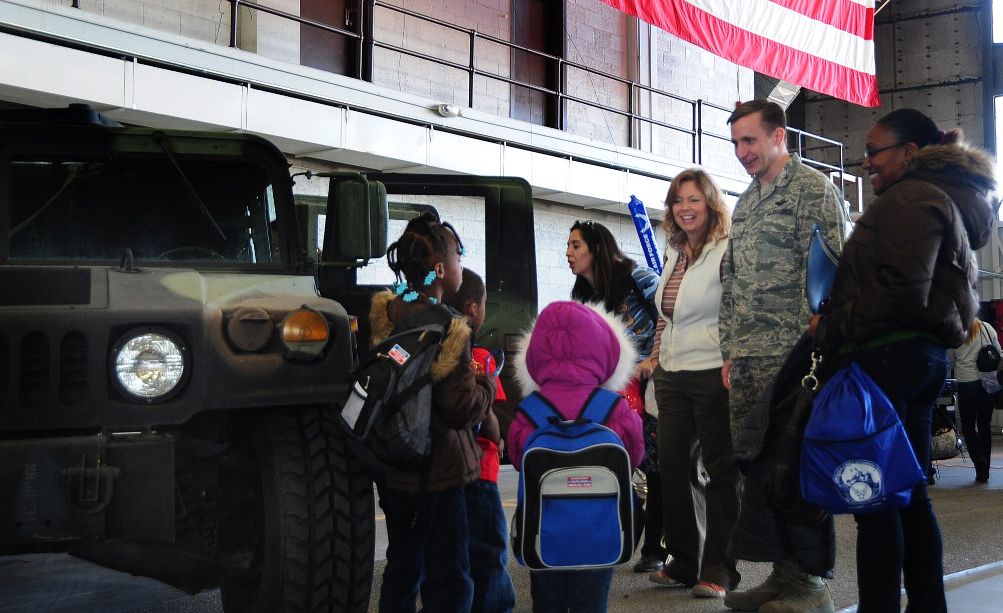 ELLSWORTH AIR FORCE BASE, S.D. -- Col. Jeffrey Taliaferro, 28th Bomb Wing commander, and his wife, Ellie, speak with the children during the Kids, Spouses and Teachers Understanding Deployment Operations event, March 13.  The event emphasized the importance of giving the families of Airmen a better understanding of what it means to deploy. (U.S. Air Force photo/Airman 1st Class Anthony Sanchelli)