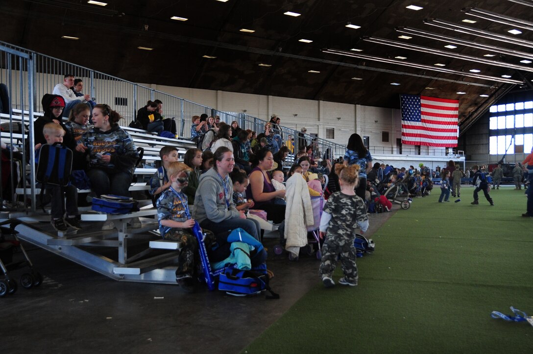 ELLSWORTH AIR FORCE BASE, S.D. -- Airmen and their families gather at the Pride Hangar for the Kids, Spouses and Teachers Understanding Deployment Operations event, March 13.  The event covered processing through a deployment line, demonstrations from various organizations on base and a B-1B Lancer tour. (U.S. Air Force photo/Airman 1st Class Anthony Sanchelli) 