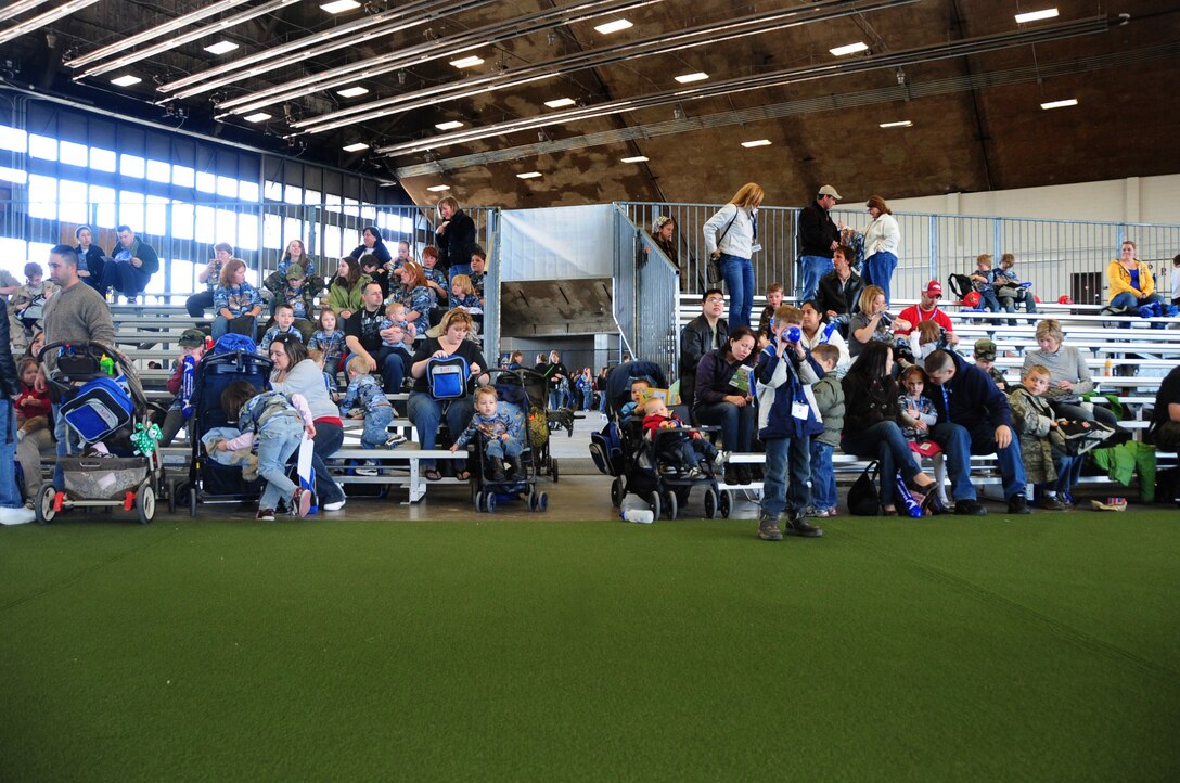ELLSWORTH AIR FORCE BASE, S.D. -- Airmen and their families gather at the Pride Hangar for the Kids, Spouses and Teachers Understanding Deployment Operations event, March 13.  The event covered processing through a deployment line, demonstrations from various organizations on base and a B-1B Lancer tour. (U.S. Air Force photo/Airman 1st Class Anthony Sanchelli)