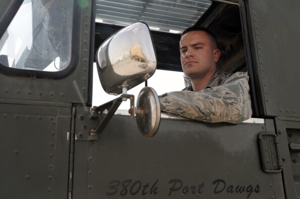 Senior Airman Douglas Misko, an air transportation journeyman with the 380th Expeditionary Logistics Readiness Squadron Air Terminal Operations Center, works in a 60,000-pound capable aircraft loader during operations on the flightline at a non-disclosed base in Southwest Asia on March 1, 2010. Airman Misko is deployed from the 89th Aerial Port Squadron at Joint Base Andrews, Md., and his hometown is Helena, Mont. (U.S. Air Force Photo/Master Sgt. Scott T. Sturkol/Released)