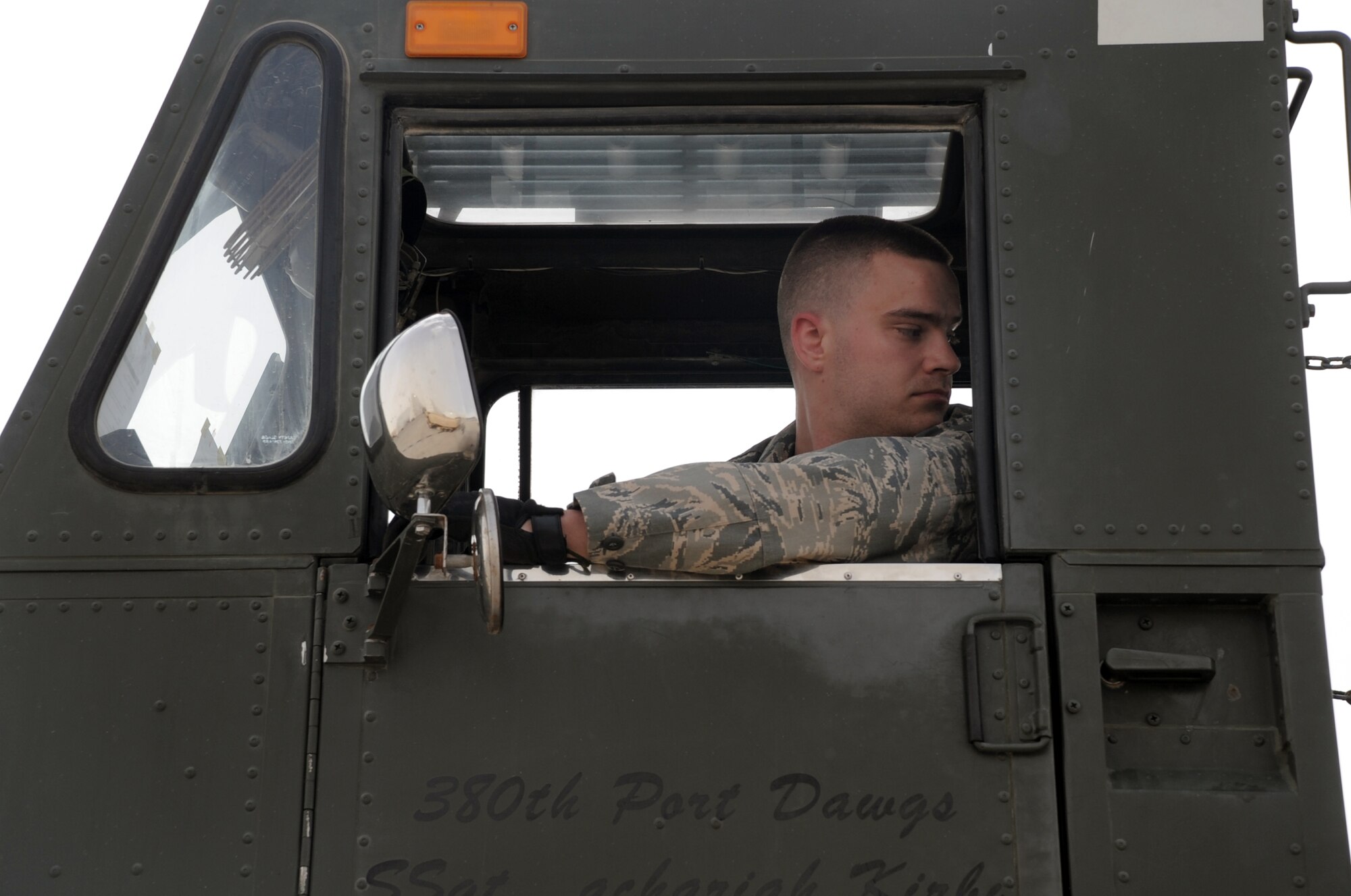 Senior Airman Douglas Misko, an air transportation journeyman with the 380th Expeditionary Logistics Readiness Squadron Air Terminal Operations Center, works in a 60,000-pound capable aircraft loader during operations on the flightline at a non-disclosed base in Southwest Asia on March 1, 2010. Airman Misko is deployed from the 89th Aerial Port Squadron at Joint Base Andrews, Md., and his hometown is Helena, Mont. (U.S. Air Force Photo/Master Sgt. Scott T. Sturkol/Released)