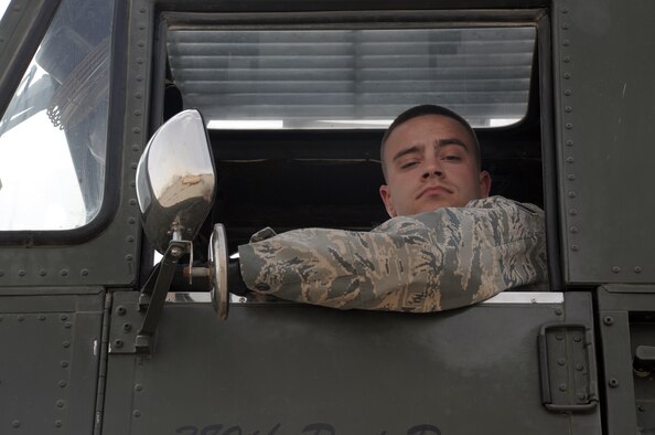 Senior Airman Douglas Misko, an air transportation journeyman with the 380th Expeditionary Logistics Readiness Squadron Air Terminal Operations Center, works in a 60,000-pound capable aircraft loader during operations on the flightline at a non-disclosed base in Southwest Asia on March 1, 2010. Airman Misko is deployed from the 89th Aerial Port Squadron at Joint Base Andrews, Md., and his hometown is Helena, Mont. (U.S. Air Force Photo/Master Sgt. Scott T. Sturkol/Released)