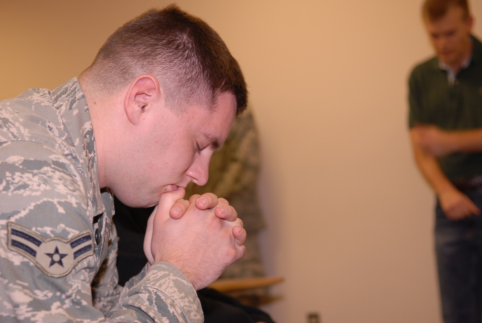 An Airman from the 3rd Aerial Port Squadron here takes time to think before leaving for a deployment. Fifteen members of 3rd APS deployed to Camp Bastion, Afghanistan March 10. (U.S. Photo by 2nd Lt. Cammie Quinn)
