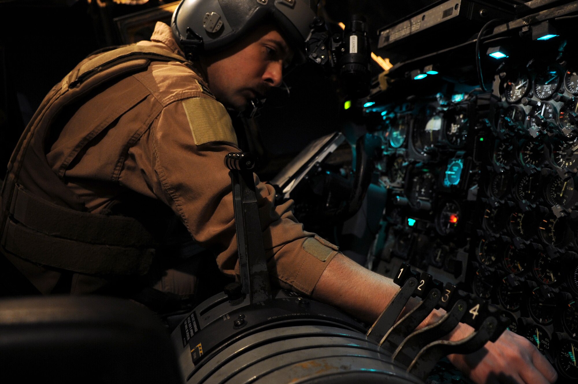 Capt. David Jones, 777th Expeditionary Airlift Squadron  C-130 pilot, does a pre-flight check of a C-130E before its last combat mission at Joint Base Balad, Iraq, on March 6, 2010. The aircraft has served in many different roles such as humanitarian missions, airlift transport of troops and equipment, and operations during Desert Storm. (U.S. Air Force photo/Senior Airman Brittany Y. Bateman/Released)