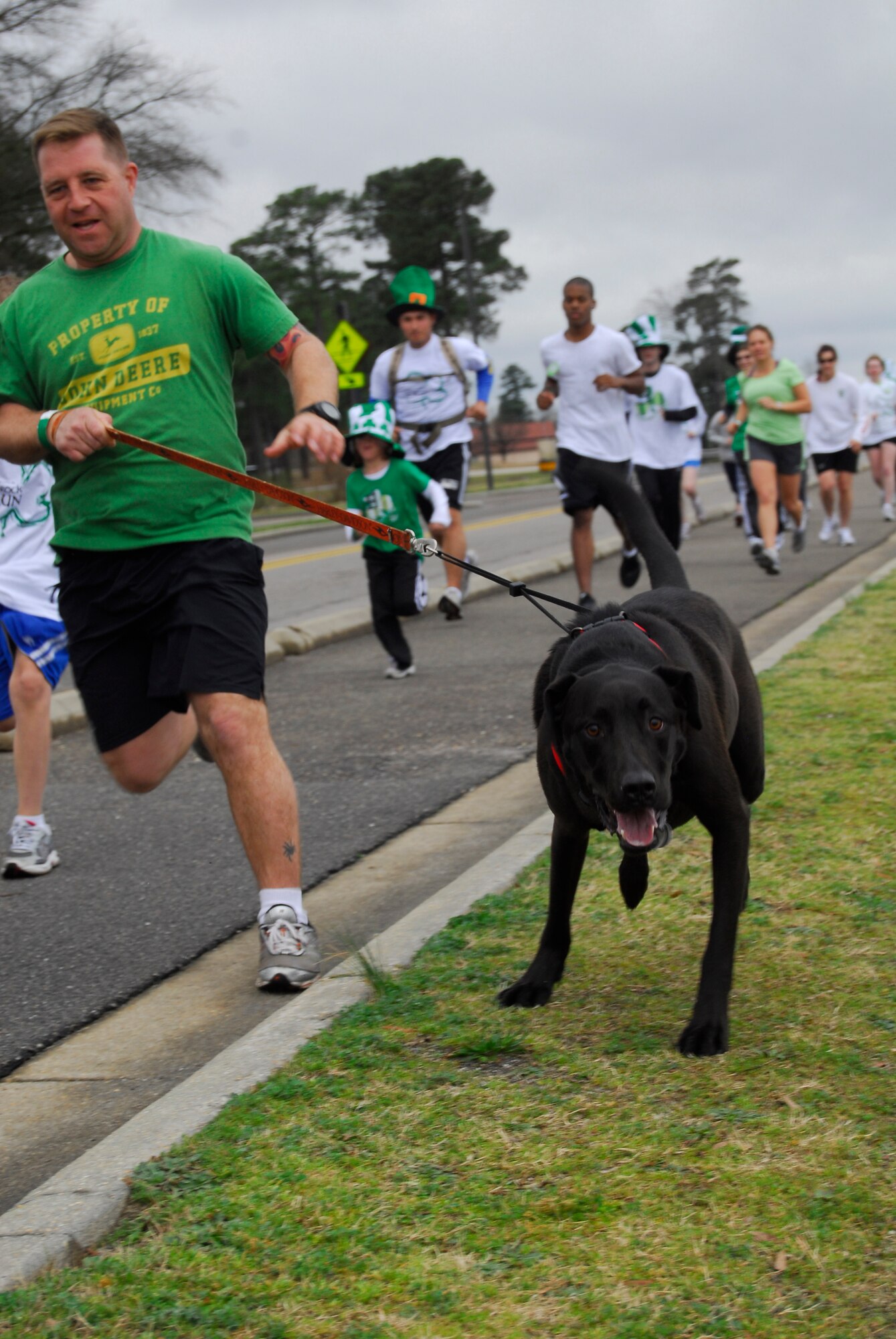 Pope Airmen and their families partcipate the 43rd Force Support Squadron's Shamrock and Run at the Fitness Center March 13. Participants ran a two-mile loop along the flightline. (U.S. Air Force photo by 2nd Lt. Cammie Quinn)