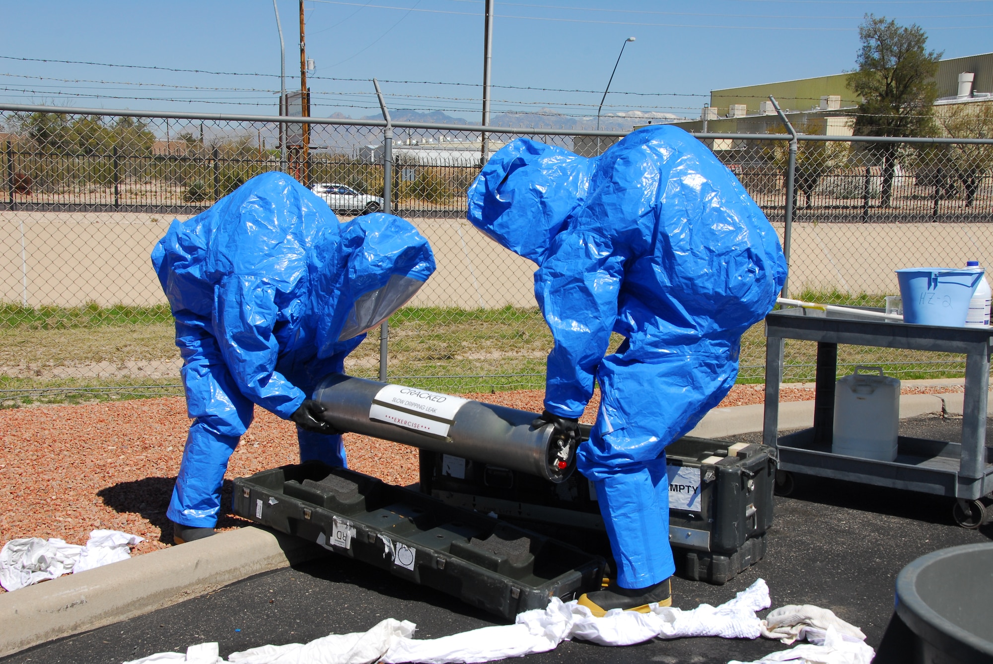 First responders from the base fire station contain a simulated hazardous material spill March 12 as part of a compliance inspection exercise. The 162nd Fighter Wing at Tucson International Airport is hosting an inspection team from Air Education and Training Command March 10-16. (Air Force photo by Master Sgt. Dave Neve)