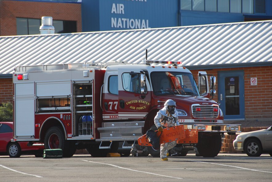 A first responder from the base firestation arrives on the scene of a simulated accident March 12 as part of a compliance inspection exercise. The 162nd Fighter Wing at Tucson International Airport is hosting an inspection team from Air Education and Training Command March 10-16. (Air Force photo by Master Sgt. Dave Neve)