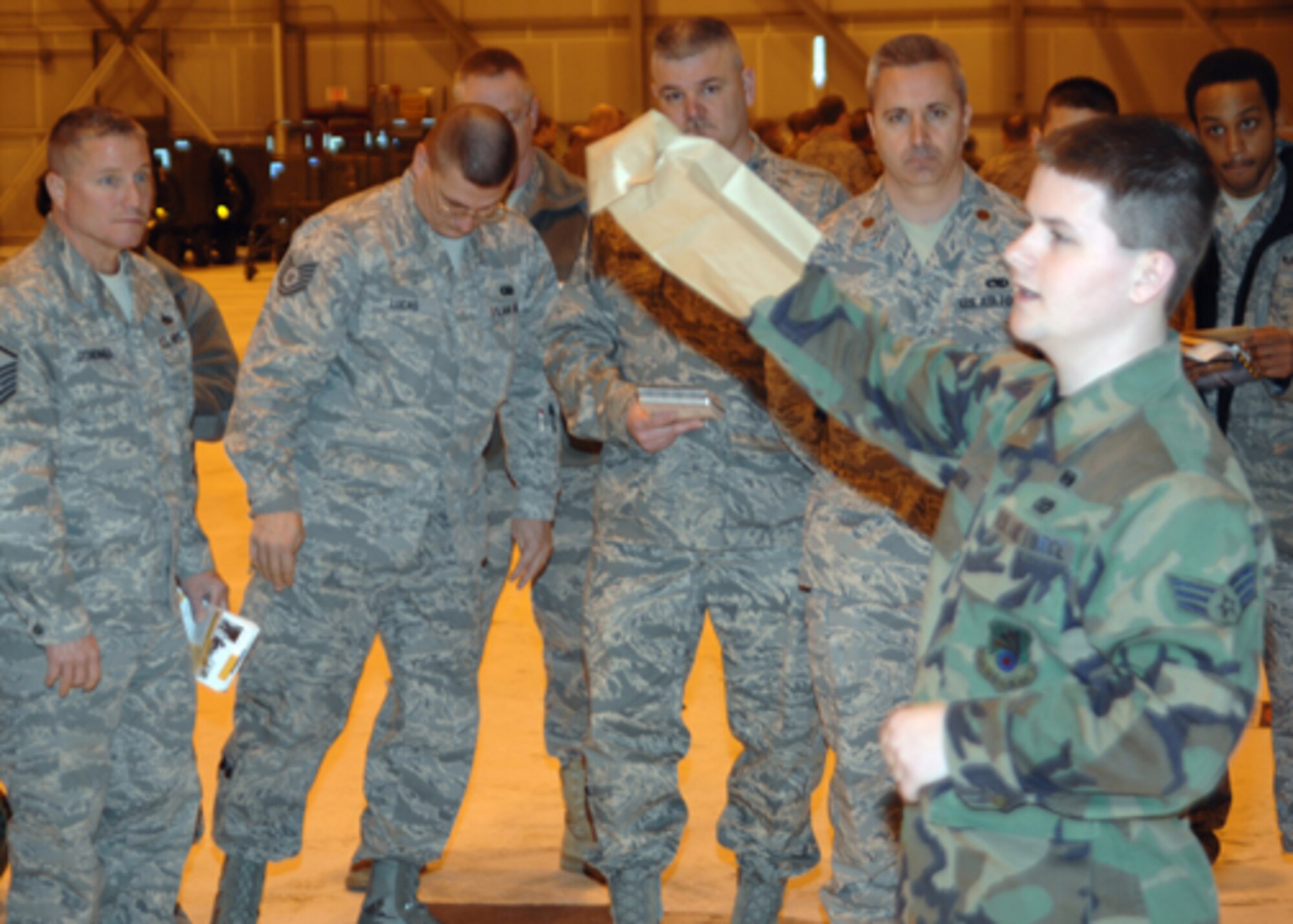 GRISSOM AIR RESERVE BASE, Ind. -- The Ability to Survive and Operate refresher was designed to help Airmen brush up on chemical decontamination procedures. Senior Airman Joseph Smith, 434th Civil Engineer Squadron emergency management apprentice, instructs Grissom members on how to properly use individual decontaminate equipment.  (U.S. Air Force photo/Senior Airman Carl Berry)