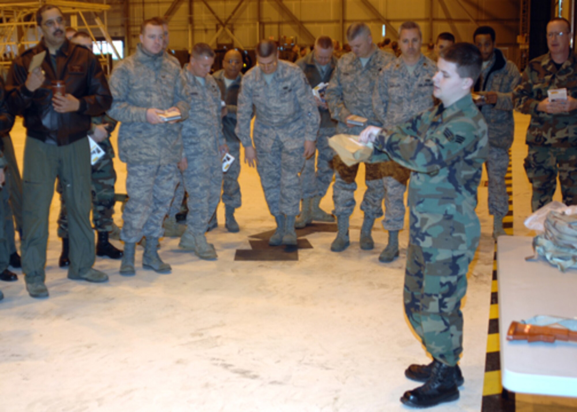 GRISSOM AIR RESERVE BASE, Ind. -- The Ability to Survive and Operate refresher was designed to help Airmen brush up on chemical decontamination procedures. Senior Airman Joseph Smith, 434th Civil Engineer Squadron emergency management apprentice, instructs Grissom members on how to properly execute decontaminate procedures.  (U.S. Air Force photo/Senior Airman Carl Berry)