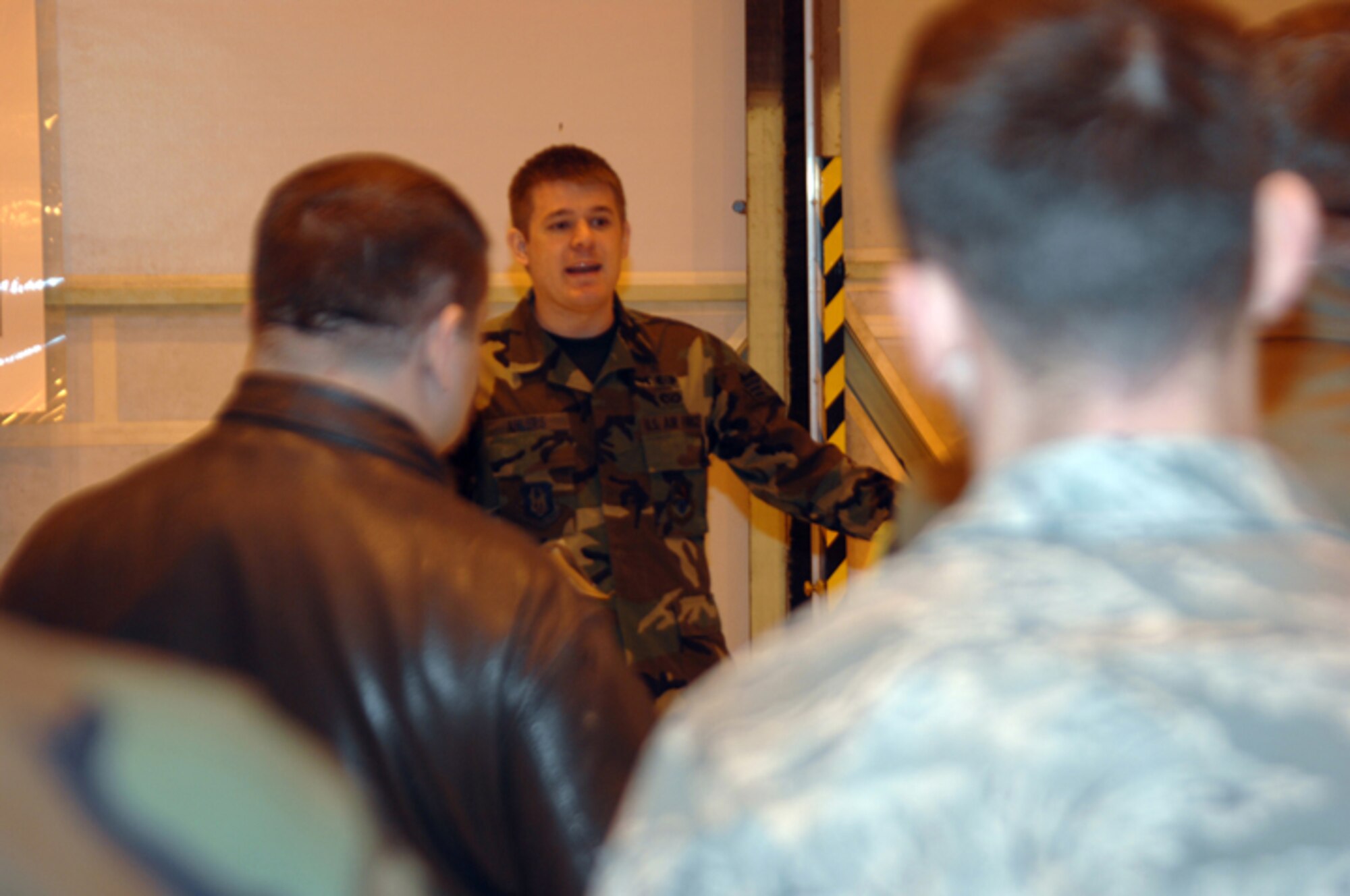 GRISSOM AIR RESERVE BASE, Ind. -- As part of their ancillary training, Grissom reservist participated in several Ability to Survive and Operate exercises. Senior Airman Joseph Ahlers, 434th Civil Engineer Squadron readiness apprentice, gives instructions on how to properly navigate through transition control points. (U.S. Air Force photo/Senior Airman Carl Berry)