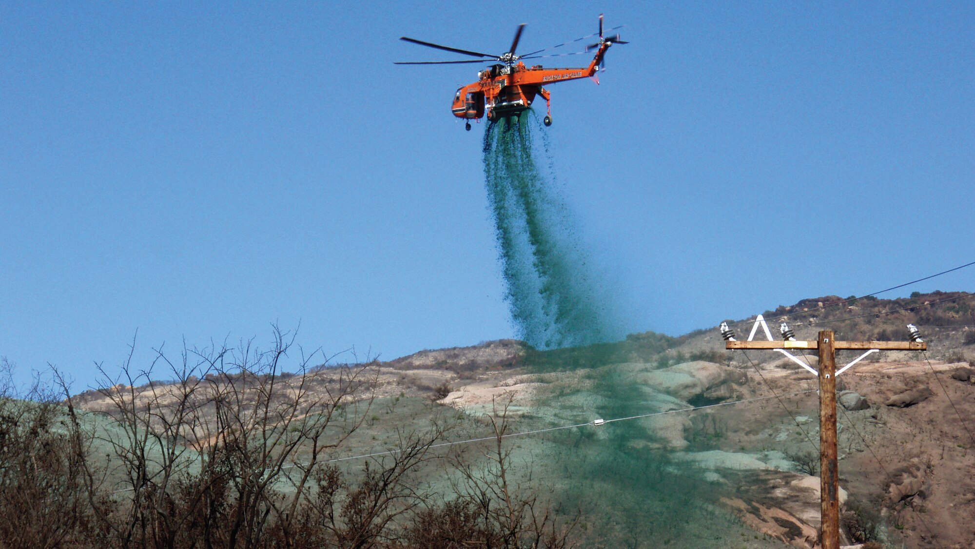 Hydromulch, used for reseeding and erosion control and manufactured by Fiberwood LLC at the former McClellan Air Force Base in Sacramento, Calif., is sprayed after a grass fire near Santa Barbara, Calif. The mulch, made of recycled newspaper, can be applied as soon as a fire is out. (Courtesy photo)