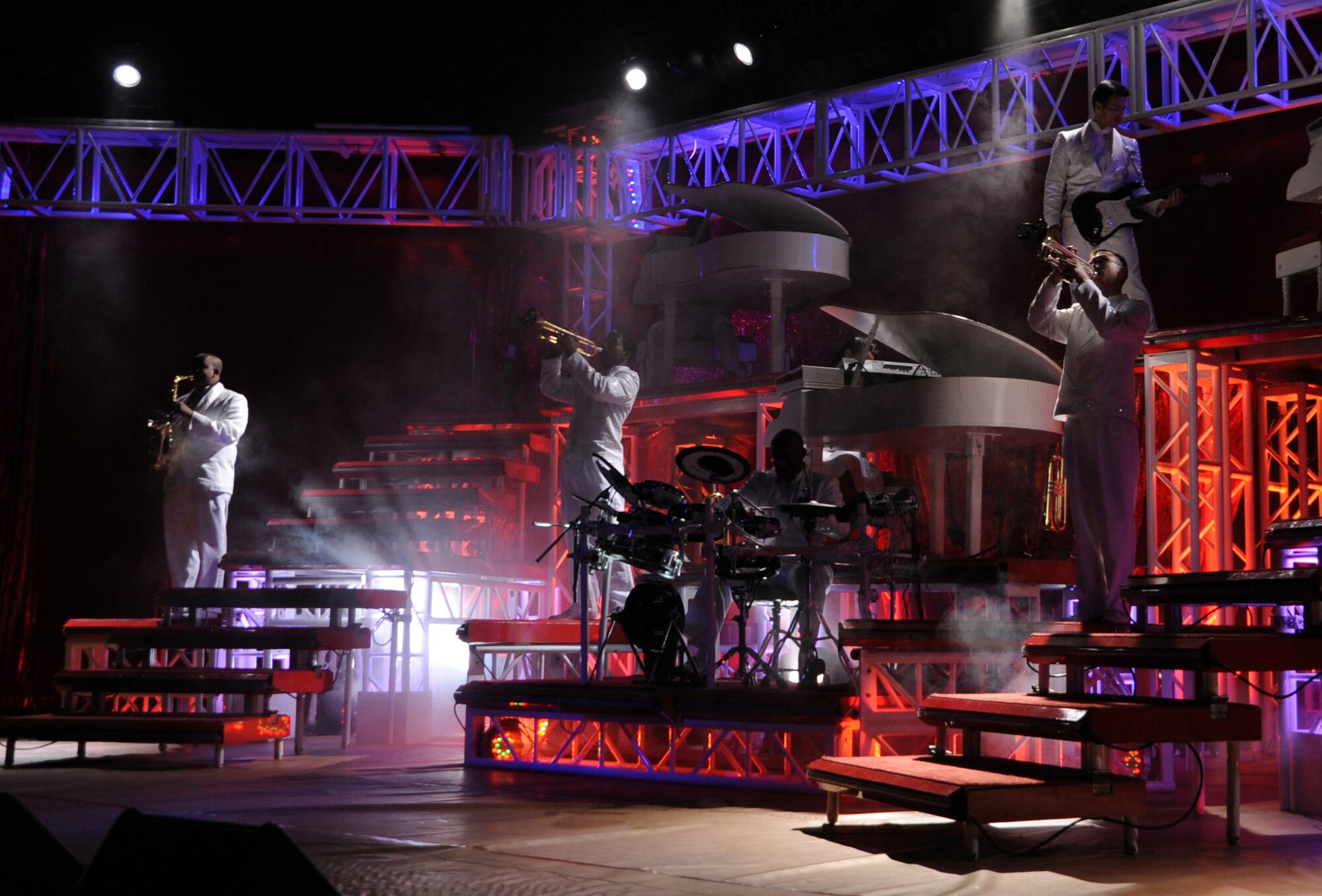 Instrumentalists play in tune with the drummer during the Tops in Blue concert at the Greyhound Arena Mar 6. The first Tops in Blue cast entertained over 320,000 active duty military members and their families in 1953. (U.S. Air Force photo by Airman 1st Class Maynelinne De La Cruz)  