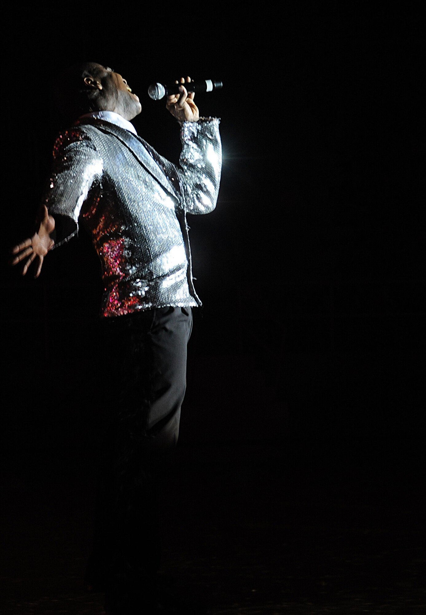 Tech. Sgt. Octavious Hill, 99th Civil Engineer Squadron, performs for the Clovis and Portales community during the Tops In Blue tour Mar 6 at the Greyhound Arena. Tops in Blue performers entertain Airmen and local communities worldwide with singing and dancing routines. (U.S. Air Force photo by Airman 1st Class Maynelinne De La Cruz)