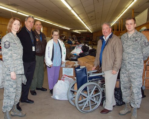 FORT WALTON BEACH, Fla. -- Volunteers with the 505th Command and Control Wing drop off donated items to the Waterfront Rescue Mission on March 4. From left is Master Sgt. Donna Hustad, David Docarmo, Lt. Col. Ray Roszkowski, a volunteer worker at the mission, Thom Guthrie and Tech. Sgt. Richard Fox.  
The group held a donation drive to provide food, clothing, blankets, and hygiene items for those in need. (U.S. Air Force photo/Keith Keel)