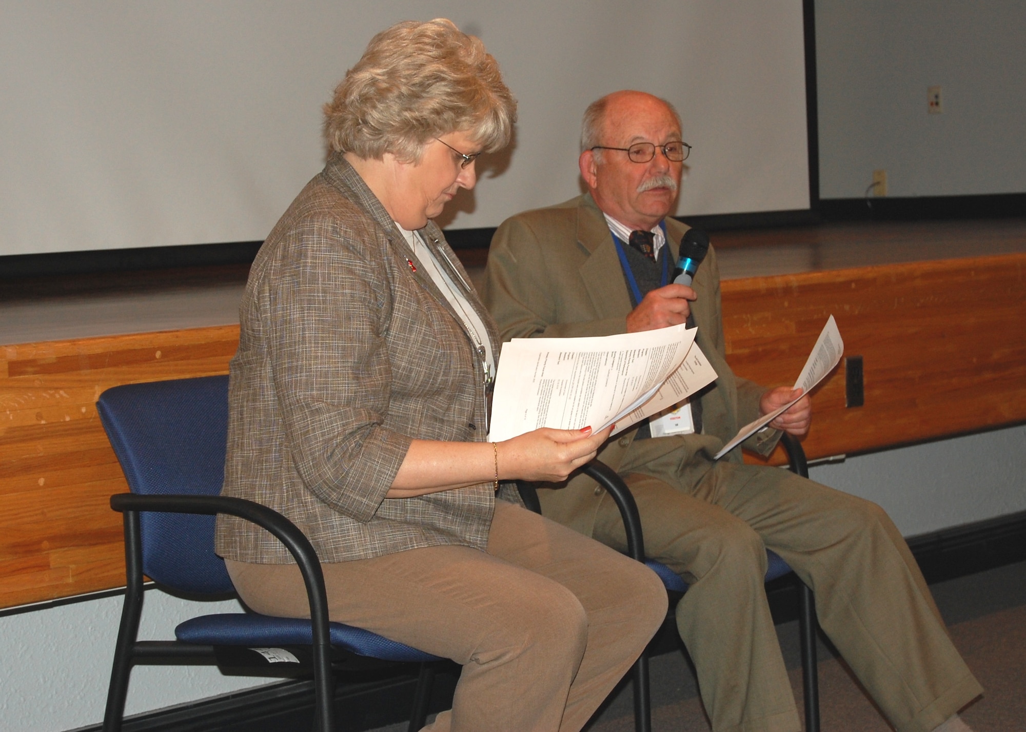 The Joint Commission surveyors nurse Connie Schultz and Dr. George Orndorff address the 81st Medical Group staff during their March 11 out brief following completion of their portion of the tandem survey/inspection that began March 8.  They praised the staff for the medical care they provide.  Official word of the hospital’s continued three-year accreditation from TJC is expected in about a month. (Photo by Steve Pivnick)