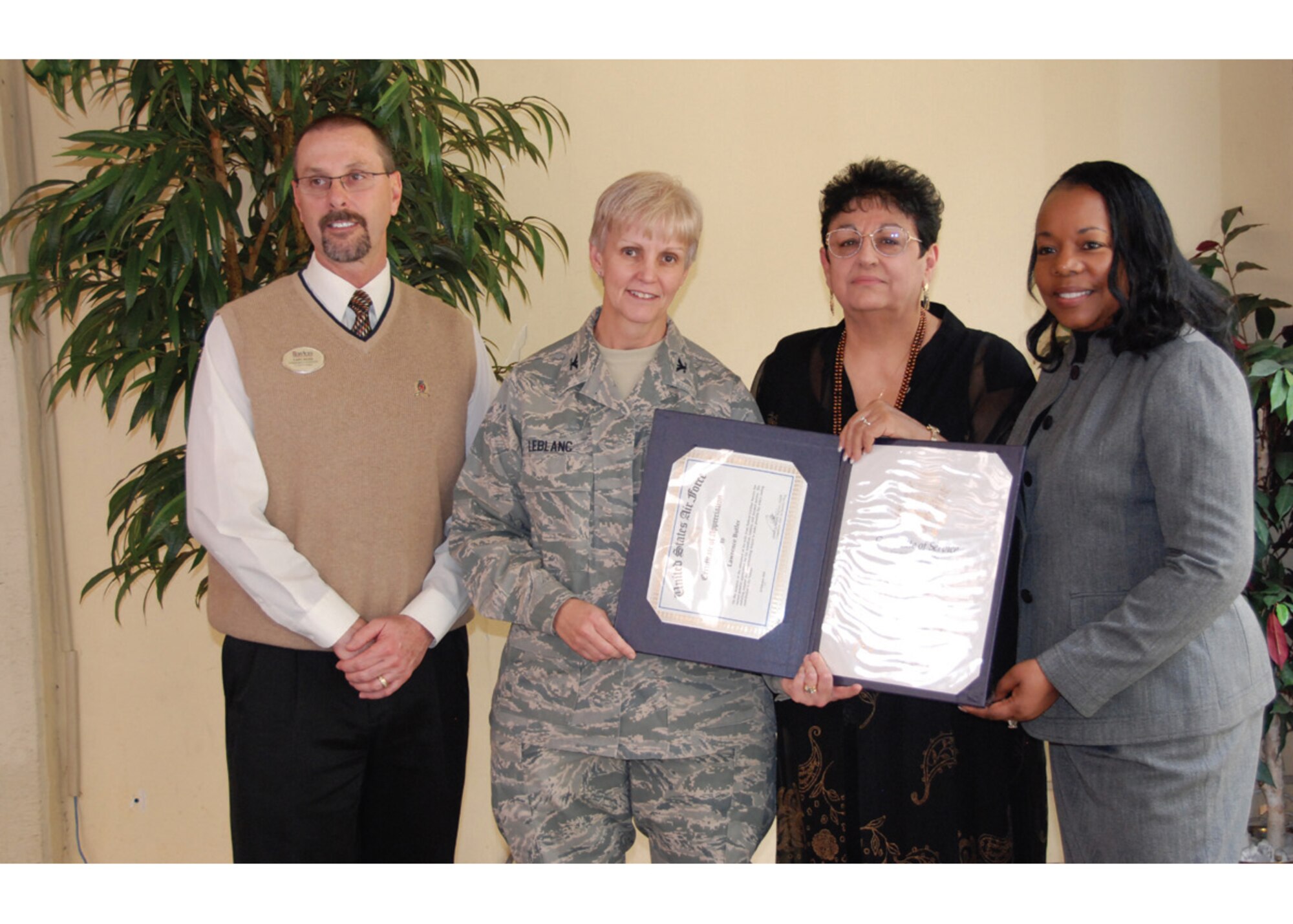 Linda Butler (second from right) of the 452nd Force Support Squadron retired in a ceremony Feb. 24. She is pictured here with (left to right) Cary Kerr, Col. Pamela LeBlanc and Iris Alexander. Butler began working for the federal government in February 1988. (U.S. Air Force photo)