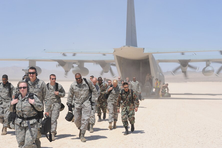 Members of the 615th Contingency Response Wing arrive to the dusty desert landscape of Bicycle Lake, Ft. Irwin, Calif., one of the four main backdrops in Northern California for the two-week-long 2009 HYDRA EXERCISE. (U.S. Air Force photo/Master Sgt. Joe Springfield) 

