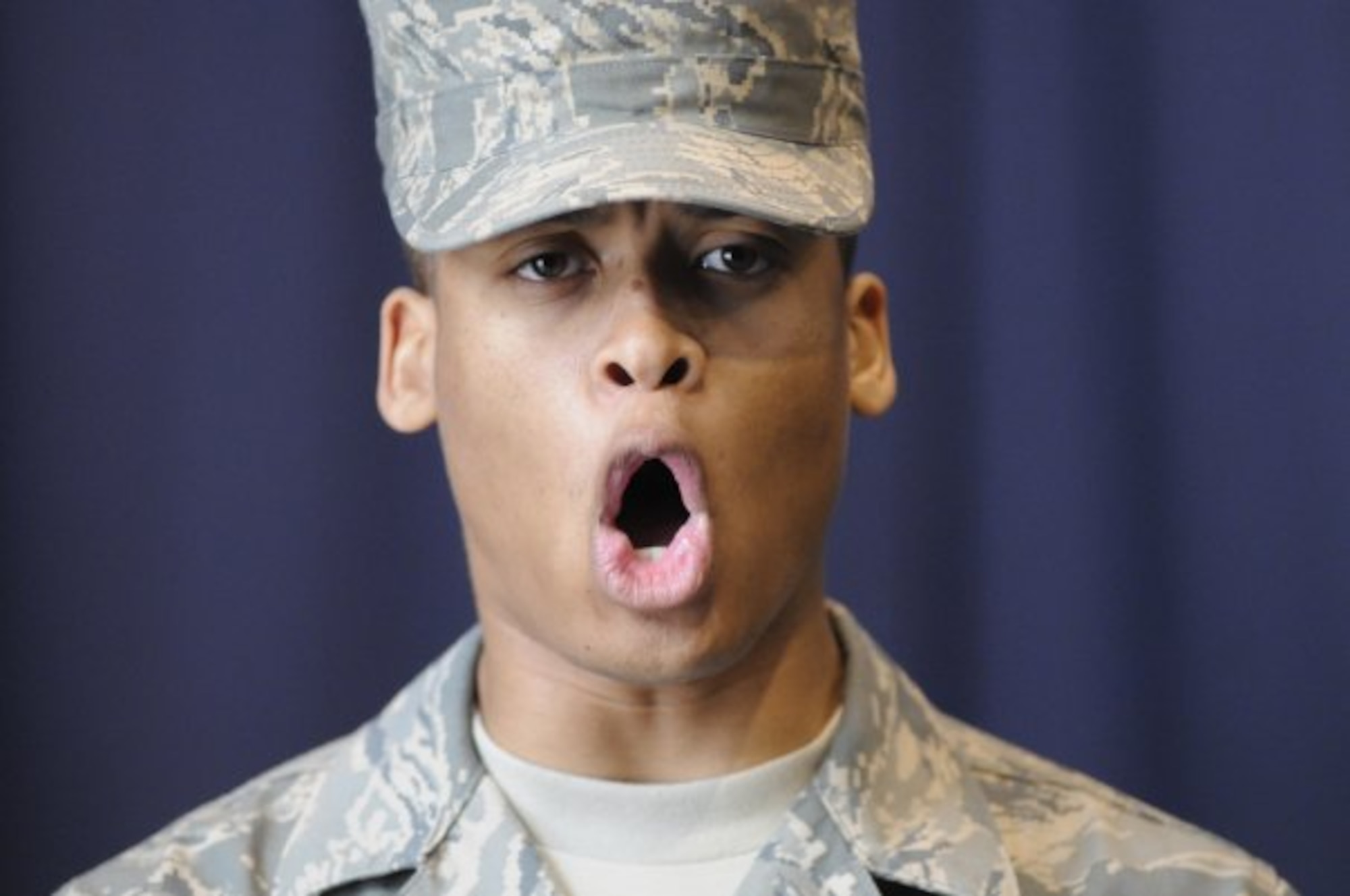 United States Air Force Airman 1st Class William Nealey III, United States Air Force Honor Guard technical school trainee, shows honor guard pride by yelling ‘1-2-3 B Flight, Hooah!’ after completing pre-evaluations, Feb. 22, 2010, inside the Honor Guard's C Hall on Bolling Air Force Base, D.C. Throughout technical school, trainees will need to pass four evaluations in order to become a member of the honor guard. (U.S. Air Force photo by Senior Airman Marleah Miller)