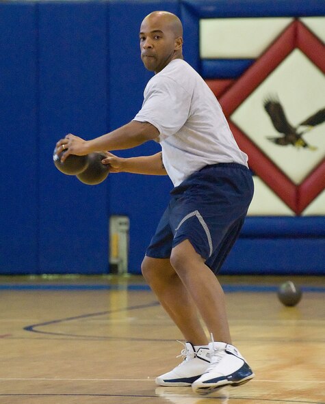 Tech. Sgt. Brad Adams, 373rd Training Squadron Military Training Leader, gets ready to throw the ball during the Dodgeball Tournament Championships March 12 at the Fitness Center. Eight teams from different squadrons battled each other on the basketball court to garner the title as Dodgeball Tournament Champions. The 436th Operations Support Squadron won first place. (U.S. Air Force photo/Jason Minto)