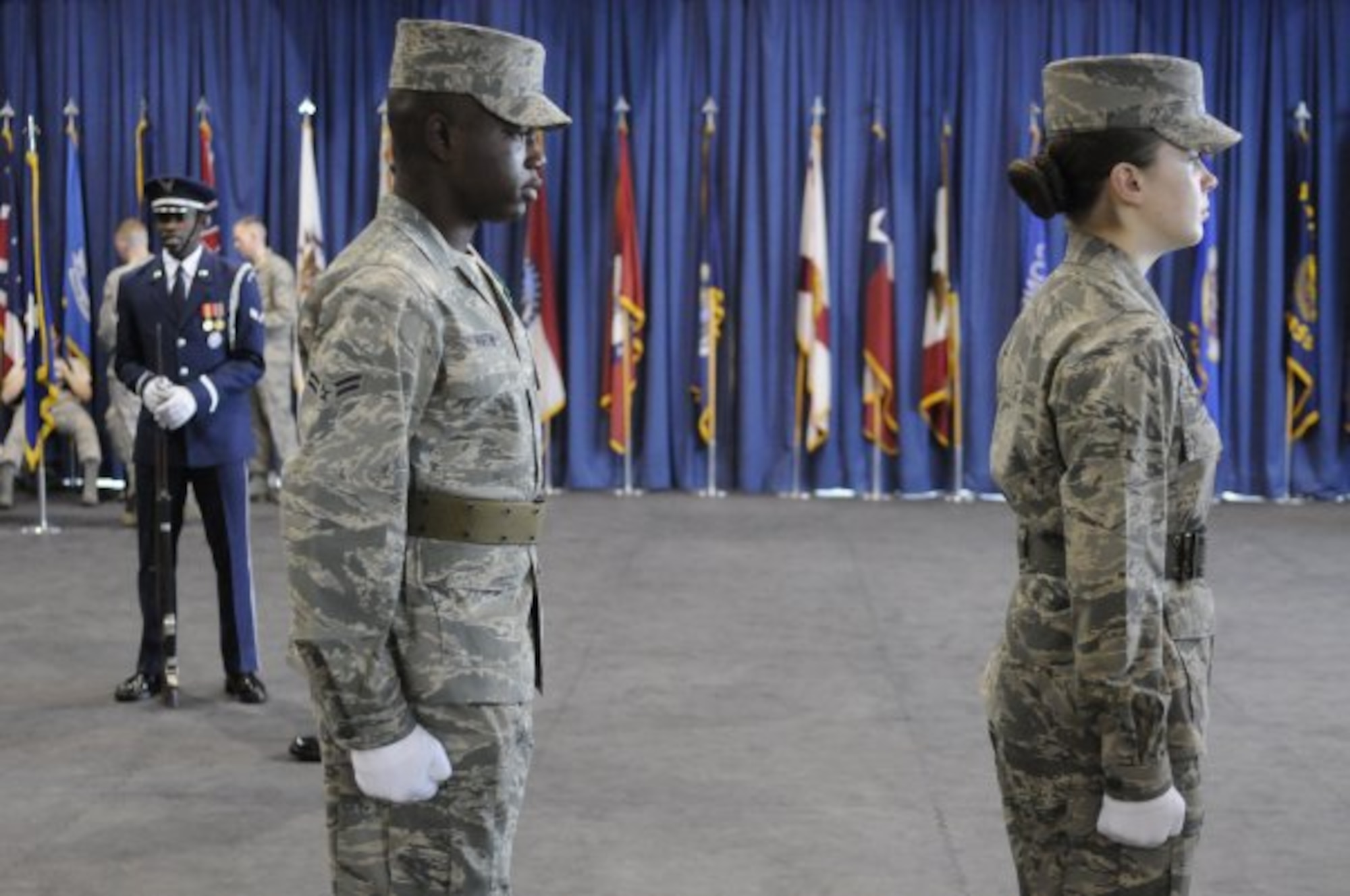 U.S. Air Force Airman 1st Class Roger D. Ruffin, and Airman Basic Tabatha Zimmer, United States Air Force Honor Guard technical school trainees, practice facing movements, Feb. 22, 2010, inside the Honor Guard's C Hall on Bolling Air Force Base, D.C. During the next eight weeks, trainees will learn what it takes to be a part of the USAF Honor Guard. (U.S. Air Force photo by Senior Airman Marleah Miller)