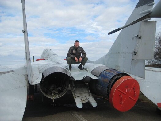 KECSKEMÉT AIR BASE, HUNGARY – Capt. Jozsef Jonas, 75th Fighter Squadron executive officer, poses here in February on top of a Mig-29 Fulcrum in on Kecskemét Air Base, Hungary. Captain Jonas spent 10 days sharing his close-air-support experiences with about a dozen fighter pilots, some of which he previously served with during his time in the Hungarian air force. (Courtesy photo)