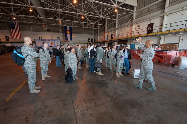 U.S. Air Force Master Sgt. Anthony Cook, First Sergeant for the Colorado Air National Guard’s 140th Medical Group at Buckley Air Force Base, calls personnel forward for formation in preparation for the group’s departure to Honolulu, March 13, 2010. Cook is part of a more than 60-person team supporting E Malama Kakou (translated from Hawaiian as “to care for all”). E Malama Kakou is part of the Office of the Assistant Secretary of Defense for Reserve Affairs Innovative Readiness Training Program. (U.S. Air Force photo/Master Sgt. John Nimmo, Sr.) (RELEASED)